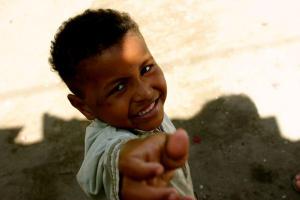 Boy reaching for candy